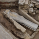 A human-shaped lead sarcophagus at center, in Paris' Notre Dame.